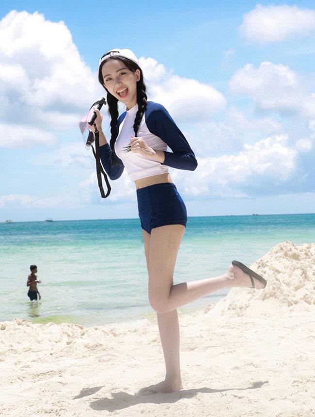 ngoc trinh gay bat ngo khi... mac ao tam "kin nhu bung" - 7